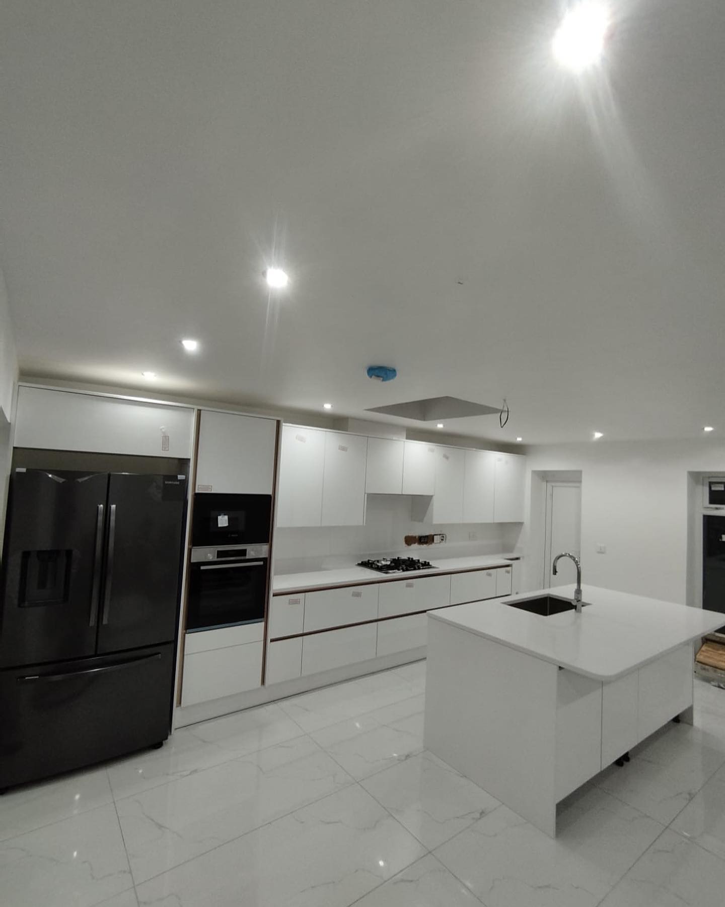 Bright white fitted kitchen